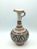 Jarra Ceramica Artesanal - Diseño Elegante con motivos pintados a mano en azul, amarillo y marrón. Ideal para decoración de interiores.
