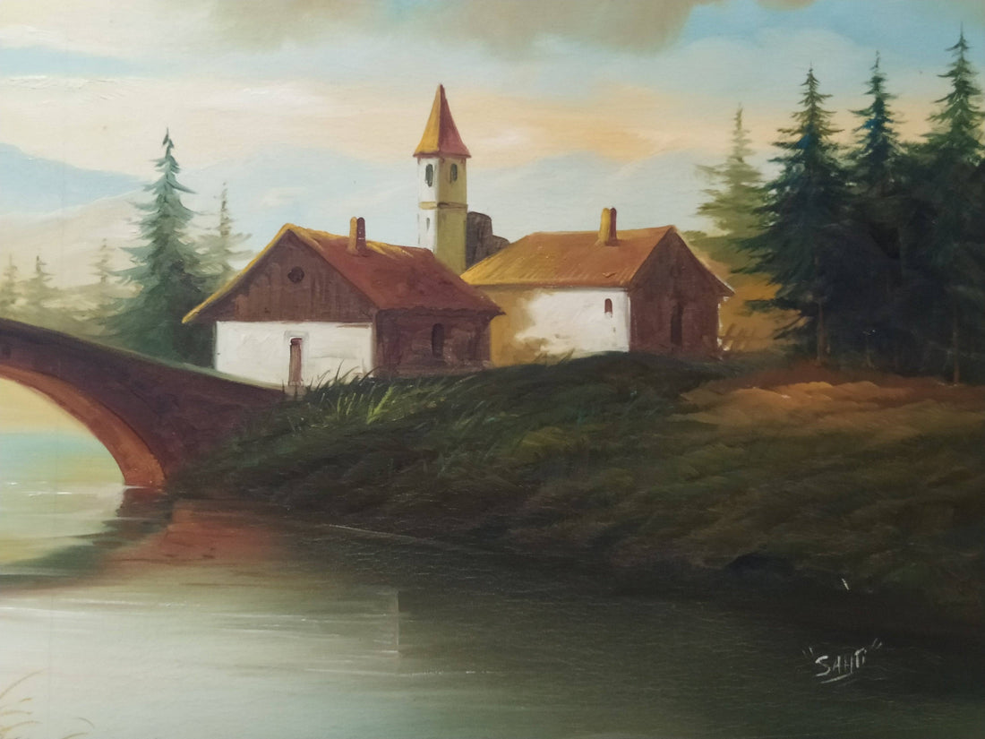 Óleo de paisaje con puente y casas rurales, enmarcado en dorado. Ideal para decoración clásica y amantes del arte naturalista.